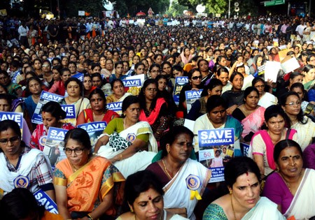 epa07092584 Members and supporters of Ayappa Dharma Samrakshana Samithi (a united forum of South Indian Ayyappa devotees) sit during a peaceful protest demanding special ordinance in relation with women's entry in Sabarimala temple, in New Delhi, India, 14 October 2018. The supreme court or the top Indian court recently allowed the women of all ages in the Lord Ayyappa Temple in Kerala's Sabarimala.  EPA-EFE/STR