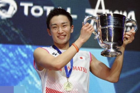 Kento Momota of Japan holds up his trophy after defeating Viktor Axelsen of Denmark in the Men's Singles final match at the All England Open Badminton tournament in Birmingham, England, Sunday March 10, 2019. (AP Photo/Rui Vieira)