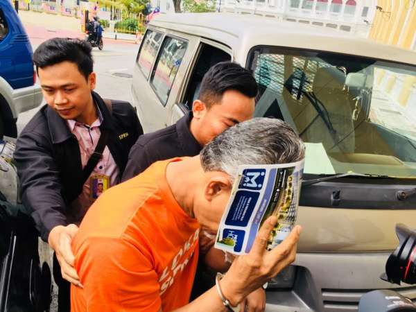 在槟城落网的嫌犯被押往法庭申请延扣。